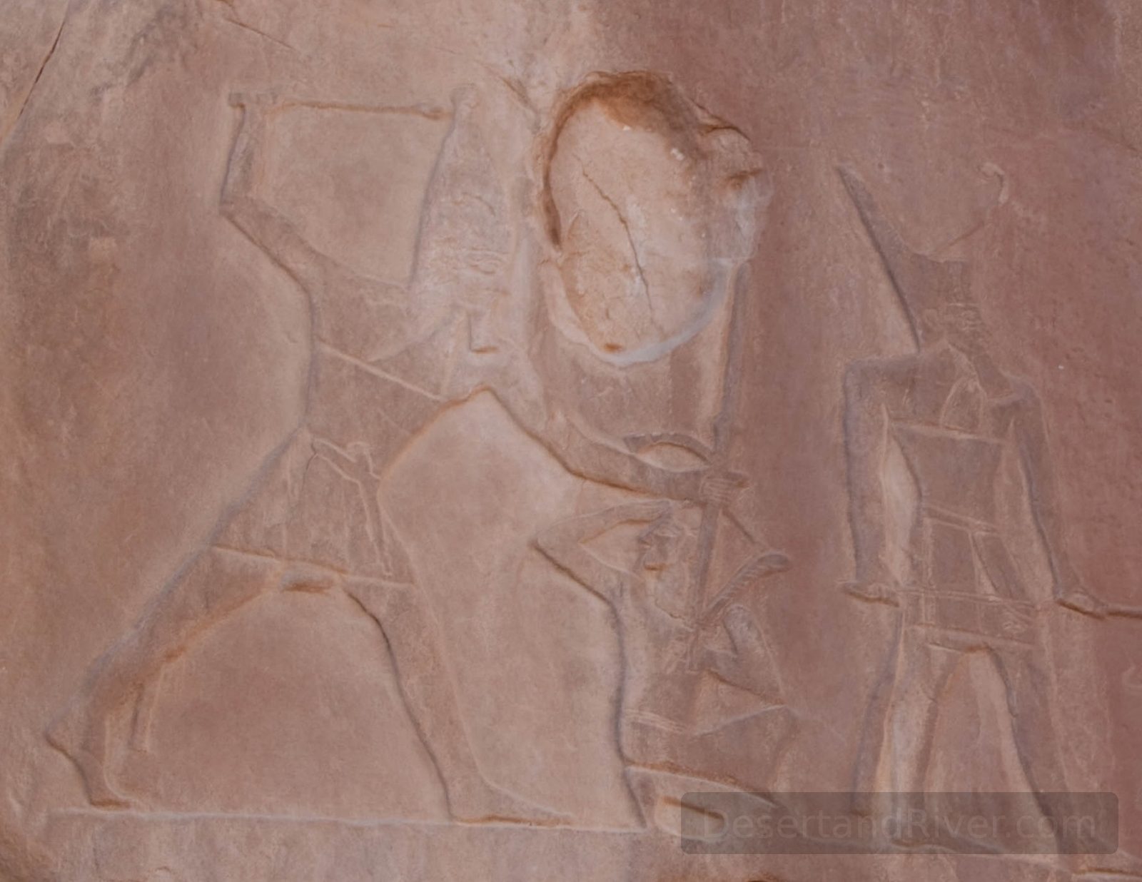 Ancient rock carving at Wadi el Maghara in South Sinai, showing human figures engraved into sandstone.