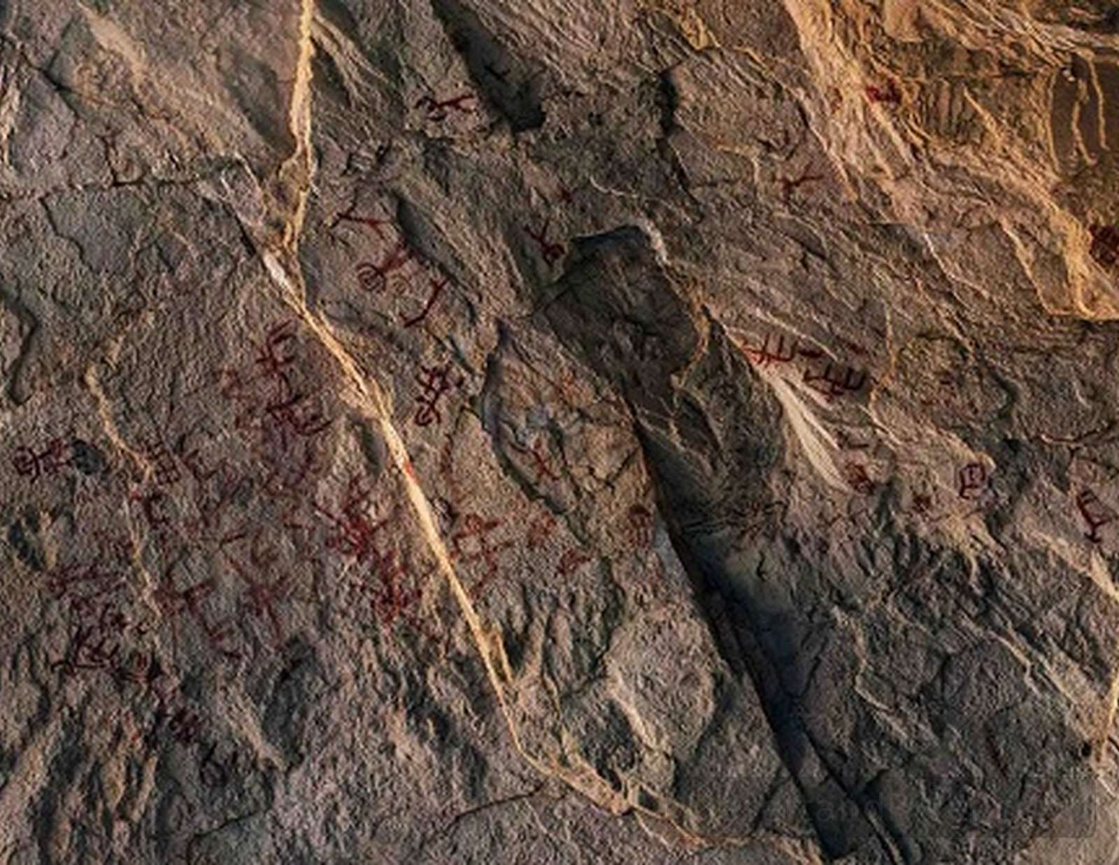 Ancient red cave paintings on limestone inside Zaraniq Cave near Wadi Zaraniq in South Sinai.